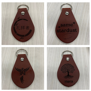 Four engraved leather key fobs