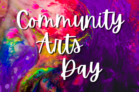 The words "Community Arts Day" in white font against a watercolor background of pink, yellow, green, blue, and purple.