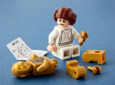 LEGO Princess Leia building C-3PO droid