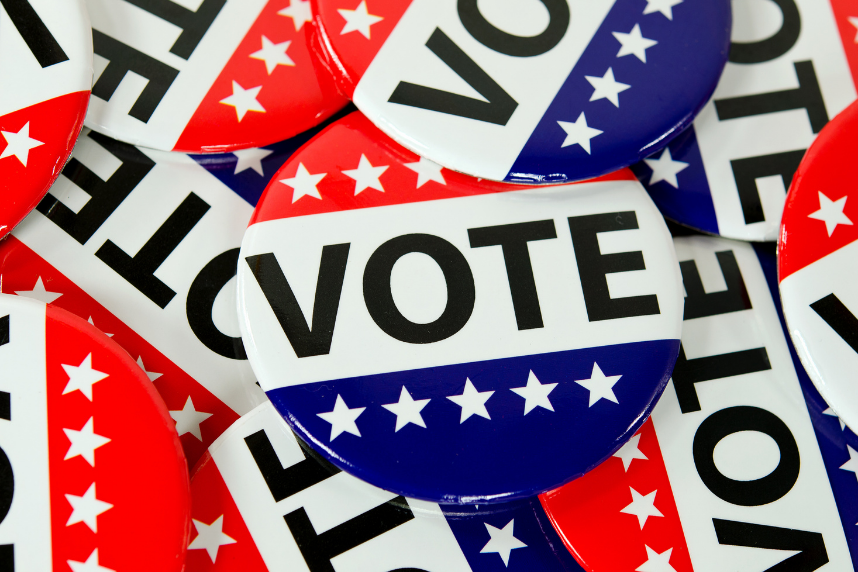 a pile of buttons reading "VOTE"