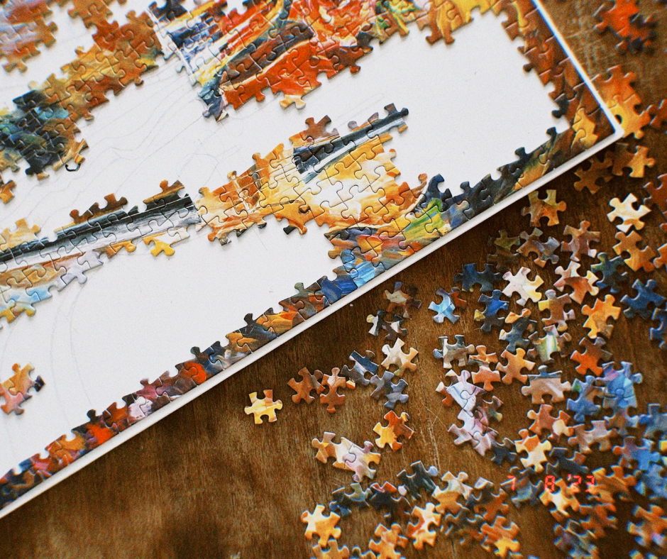 Image of a puzzle in progress of being assembled.